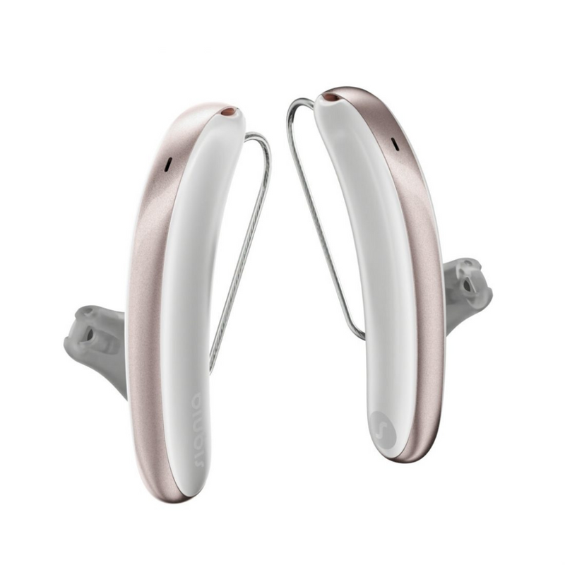 Una coppia di apparecchi acustici Signia Styletto 3AX/7AX estetici bianchi e rosa